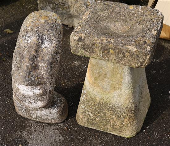 Easter Island head and a stone bird bath